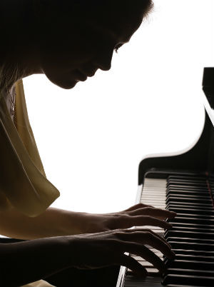 Piano student playing piano
